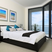 Large balconies allow homeowners to enjoy views of bed, bed frame, bed sheet, bedroom, home, interior design, mattress, property, real estate, room, wall, window, white