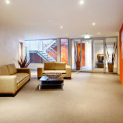 Daylight from the internal courtyad floods into the ceiling, floor, flooring, interior design, living room, lobby, real estate, room, gray