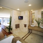 By opening up the bathroom and bedroom, and bathroom, estate, home, interior design, property, real estate, room, brown