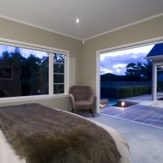 The new master bedroom opens onto the rear ceiling, estate, home, house, interior design, living room, property, real estate, room, wall, window, gray