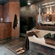 View of a remodeled bathroom which was designed bathroom, countertop, floor, flooring, interior design, room, brown