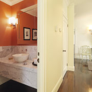 View of powder room with a marble vanity architecture, bathroom, ceiling, estate, floor, flooring, hardwood, home, interior design, laminate flooring, property, real estate, room, tile, wall, wood flooring, orange