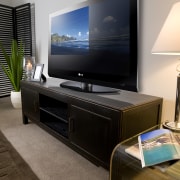 View of plasma screen tv sitting on a display device, electronics, flat panel display, furniture, interior design, multimedia, television, gray, black, brown