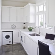 The original kitchen is now a scullery, with cabinetry, countertop, cuisine classique, floor, home, home appliance, interior design, kitchen, room, gray, white