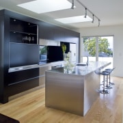 Designer Robyn Labb used a simple material palette countertop, floor, interior design, kitchen, real estate, room, gray