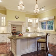 View of traditional styled kitchen in a new cabinetry, ceiling, countertop, cuisine classique, furniture, hardwood, home, interior design, kitchen, real estate, room, table, orange