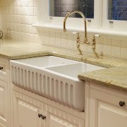 View of the double butler's sink which features bathroom, bathroom accessory, bathroom cabinet, bathroom sink, cabinetry, ceramic, countertop, floor, flooring, hardwood, kitchen, plumbing fixture, room, sink, tap, tile, wood stain, orange