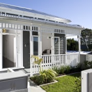 The original sash windows at the front of cottage, home, house, property, real estate, villa, white, gray