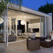 Exterior image of the outdoor living area which home, house, interior design, outdoor structure, patio, real estate, black, gray