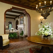 View of the entrance way which features arched ceiling, column, dining room, estate, flooring, furniture, home, house, interior design, living room, lobby, real estate, room, brown