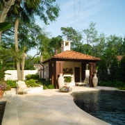 View of the cabana, water feature and pool arecales, cottage, estate, hacienda, home, house, mansion, outdoor structure, palm tree, property, real estate, resort, tree, villa, brown