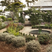 View of garden which features an antique fountain backyard, botanical garden, garden, grass, landscape, landscaping, outdoor structure, plant, tree, walkway, yard, brown