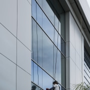 Eaxh building at Candida Office park Incorporates a architecture, building, daylighting, daytime, facade, glass, sky, window, gray