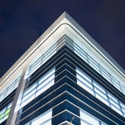 An industrial rope technician uses the Hercule track angle, architecture, building, commercial building, corporate headquarters, daylighting, daytime, facade, headquarters, landmark, line, metropolis, metropolitan area, sky, skyscraper, symmetry, tower block, blue