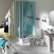 View of a bathroom which features a macerating bathroom, bathtub, floor, interior design, plumbing fixture, room, tile, gray