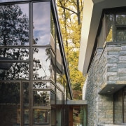 With its layered roofs and interconnected volumes, this architecture, building, facade, home, house, residential area, window, gray, black