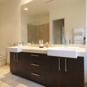 Bathroom, featuring vanity with dark-stained timber cabinetry, CaesarStone bathroom, bathroom accessory, bathroom cabinet, cabinetry, countertop, interior design, kitchen, room, sink, orange