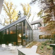 The bronze exterior window frames have a customized architecture, cottage, courtyard, facade, home, house, outdoor structure, property, real estate, residential area, window, white