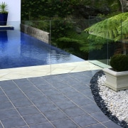 A Stain-proof sealer has been applied to the backyard, floor, flooring, landscaping, reflecting pool, swimming pool, walkway, water, water feature