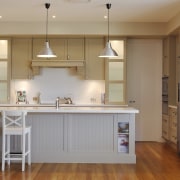 This kitchen combines classic detailing with high-end Klennmaid cabinetry, ceiling, countertop, cuisine classique, floor, flooring, hardwood, home, interior design, kitchen, real estate, room, wood flooring, gray, brown