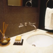 View of a bathroom vanity with tapware, marble bathroom, ceramic, floor, flooring, interior design, plumbing fixture, product design, room, sink, tile, white, brown