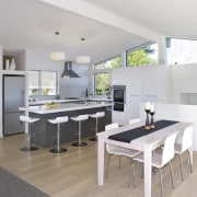 The living room and kitchen in this house architecture, interior design, kitchen, real estate, table, white, gray