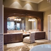 Handcrafted cabinetry frames the mirror-and the reflected view-in bathroom, cabinetry, ceiling, countertop, estate, floor, flooring, home, interior design, room, wall, window, brown