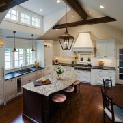 View of a kitchen designed by Drury Design cabinetry, ceiling, countertop, cuisine classique, daylighting, floor, flooring, hardwood, interior design, kitchen, laminate flooring, living room, room, window, wood flooring, gray, brown