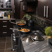 Restaurant-quality dishes are par for the course in countertop, flooring, interior design, kitchen, black