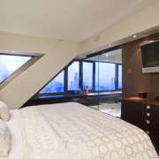 The owner chose this apartment partly because John bedroom, ceiling, estate, hotel, interior design, penthouse apartment, property, real estate, room, suite, window, gray