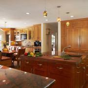 The designer has provided a separate breakfast area cabinetry, ceiling, countertop, cuisine classique, flooring, hardwood, home, interior design, kitchen, real estate, room, wood flooring, brown, gray