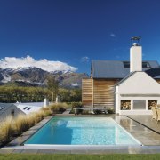 This new pool by Myfair Pools features an cottage, elevation, estate, home, house, leisure, property, real estate, residential area, resort town, sky, swimming pool, villa, water, blue