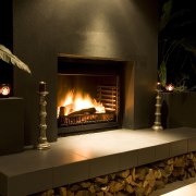 The Nouveau Outdoor Fire, available from Fires By fireplace, hearth, heat, brown, black