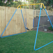 Image of outdoor play equipment created by Adams backyard, fence, grass, net, outdoor play equipment, play, playground, public space, swing, wood, yard, green