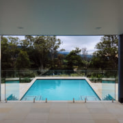 This kitcehn features Fisher &amp; Paykel appliances. architecture, daylighting, estate, glass, house, property, real estate, swimming pool, window, gray