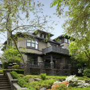 Exterior view of century old house featuring landscaping, architecture, cottage, estate, home, house, mansion, plant, property, real estate, tree, villa