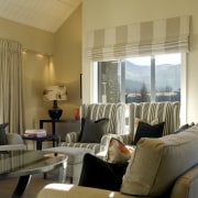 The main living areas on the upper level ceiling, interior design, living room, property, real estate, room, suite, window, window treatment, brown