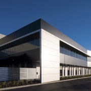 The 43,000m² industrial facility, which incorporates 3000m² of architecture, building, commercial building, corporate headquarters, daytime, elevation, facade, headquarters, property, real estate, sky, structure, blue, black