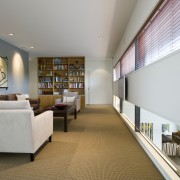 A niche window looks down from the libary architecture, ceiling, interior design, living room, lobby, real estate, room, gray, brown