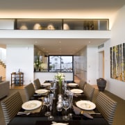 Stairs in the hallway lead up to the apartment, dining room, interior design, living room, property, real estate, gray, brown