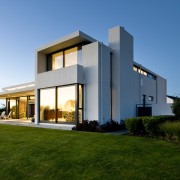 The master bedroom and ensuite occupy the upper architecture, building, elevation, estate, facade, home, house, property, real estate, residential area, sky, villa, teal