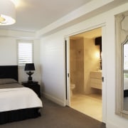 view of master bedroom which features bedroom linen, bedroom, ceiling, door, floor, home, interior design, property, real estate, room, suite, window, gray