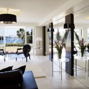 Image of a lounge area which features large furniture, home, interior design, living room, property, real estate, gray