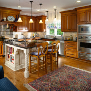 Image of a kitchen with a traditional design cabinetry, countertop, cuisine classique, floor, flooring, hardwood, home, interior design, kitchen, real estate, room, wood flooring, brown