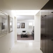 image of the hallway with the lounge area architecture, ceiling, floor, flooring, home, house, interior design, property, real estate, room, window, white, gray