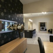 The entertainers kitchen features Charred Oak melamine cabinetry ceiling, floor, flooring, interior design, living room, lobby, real estate, room, wall, black, brown