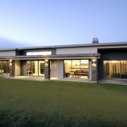 This low-line McLaren show home forms part of architecture, estate, facade, home, house, real estate, teal, brown