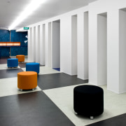 A reception desk covered in a thick pile floor, flooring, furniture, interior design, product design, white, gray