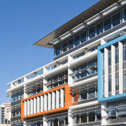 Image of the Centenary Square offices in Brisbane apartment, architecture, building, city, commercial building, condominium, corporate headquarters, daytime, facade, headquarters, hotel, metropolis, metropolitan area, mixed use, real estate, residential area, sky, teal