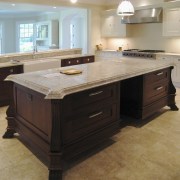 Image of a kitchen from Clive Christian which cabinetry, countertop, cuisine classique, floor, flooring, furniture, hardwood, kitchen, room, tile, wood flooring, wood stain, gray, black